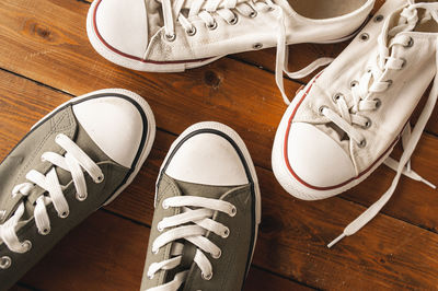 High angle view of shoes on wooden floor