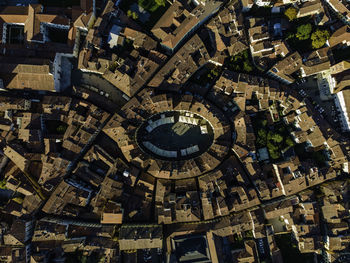 Aerial view of piazza dell'anfiteatro, a medieval square in lucca old town, tuscany, italy.