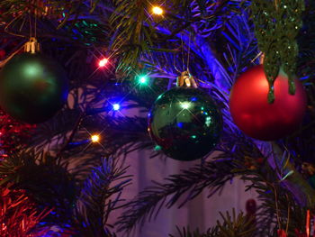 Illuminated christmas tree at night