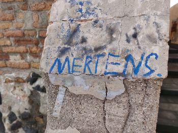 Close-up of graffiti on wall