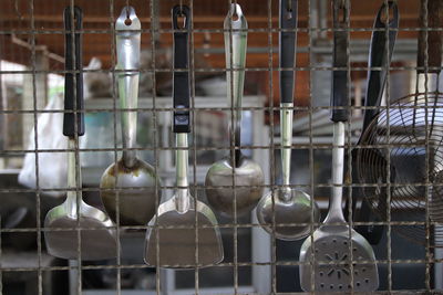 Close-up of wine bottles in container