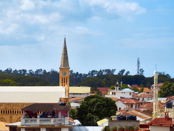 View of buildings against cloudy sky