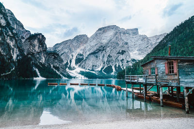 Scenic view of lake and snowcapped mountains against sky