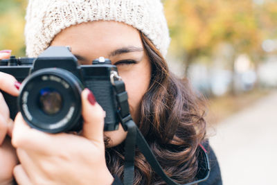 Portrait of woman photographing