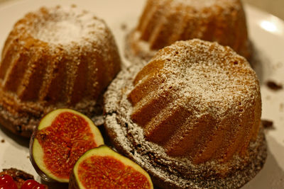 Close-up of cake figs and red currant on plate 