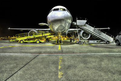 View of airplane at airport runway