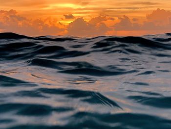 Scenic view of sea against orange sky