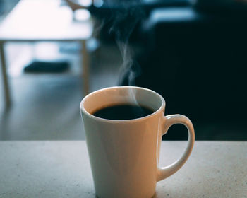 Close-up of coffee cup on table