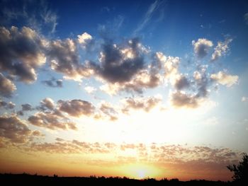 Low angle view of silhouette landscape against sky during sunset