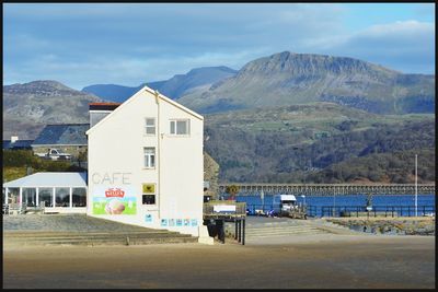 House by sea against sky