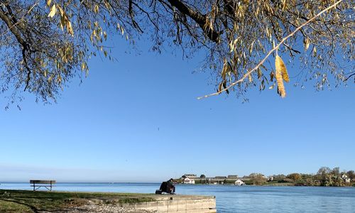 Scenic view of sea against clear blue sky