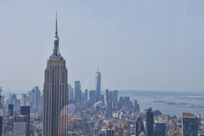 Modern buildings in city against sky