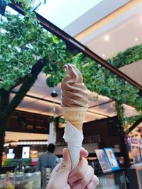 Hand holding ice cream cone