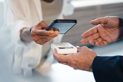 Woman paying through smart phone