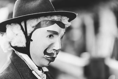 Ancient carnival of sauris. traditional wooden masks. black and white. italy