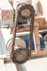 High angle view of rope tied on rusty metal