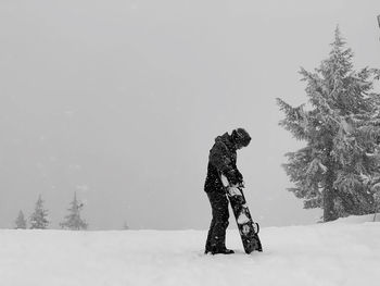 Full length of man on snow covered field