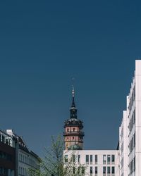 Low angle view of buildings against blue sky