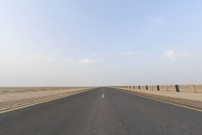 Empty road against clear sky