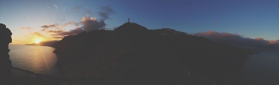 Panoramic view of sea against sky during sunset