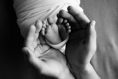 Close-up of hand holding baby