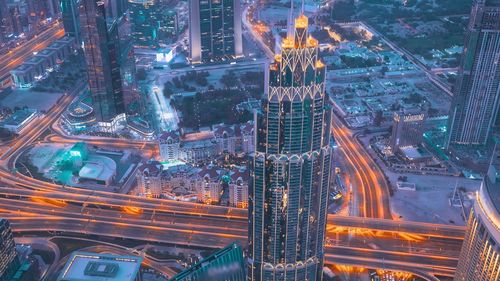 High angle view of illuminated city street at night