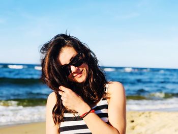 Portrait of young woman on beach