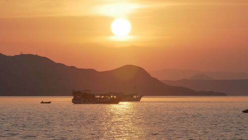 Scenic view of sea against orange sky