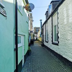 Narrow street amidst buildings against sky