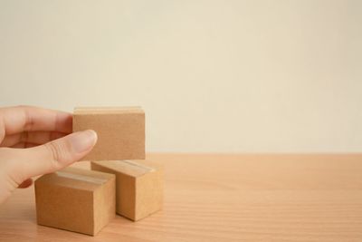 Person holding paper with toy box