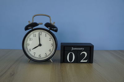 Close-up of clock on table