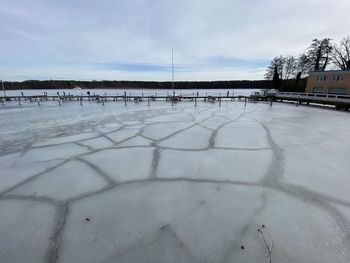 Scenic view of frozen lake against sky