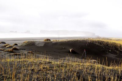 Scenic view of land against sky