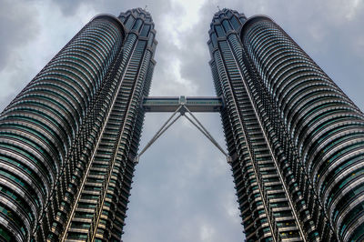 Looking up at the petronas twin towers from ground level