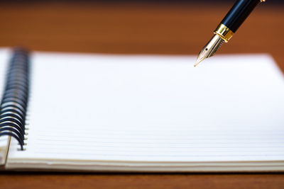 Close-up of pen on table