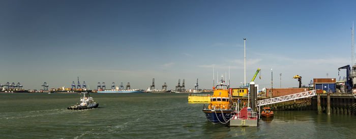 Boats in sea against sky