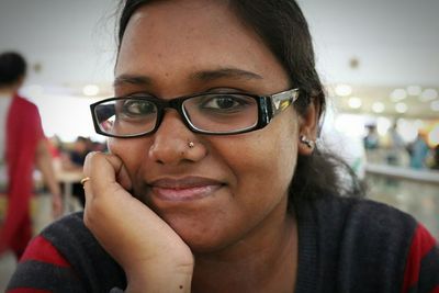 Portrait of young woman wearing sunglasses