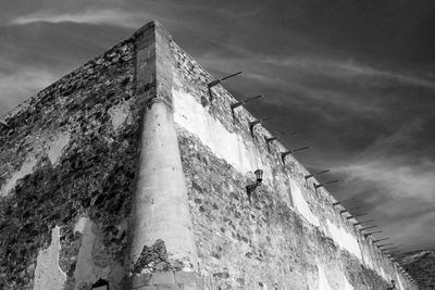 Low angle view of old building against sky