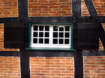 Full frame shot of window on brick wall