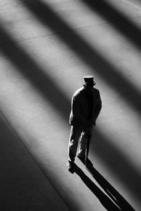 High angle view of man walking on wall