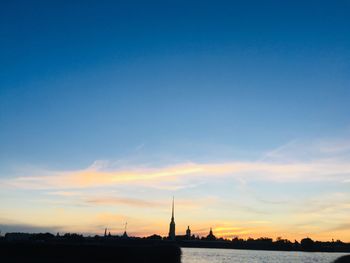 Silhouette of mosque against sky during sunset