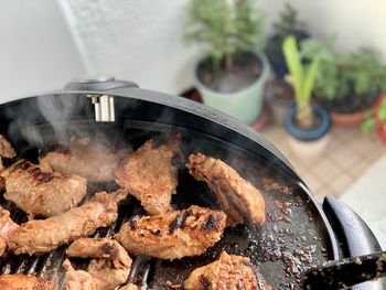 Close-up of meat on barbecue grill