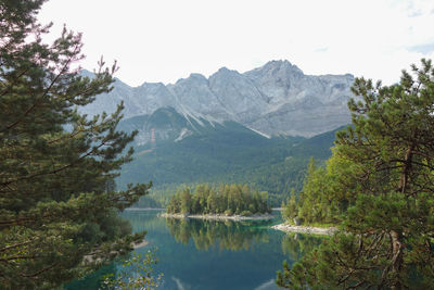 Scenic view of lake and mountains against sky