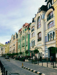 Buildings in city against sky