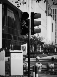 Close-up of traffic signal on road in city