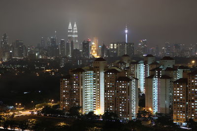 Illuminated buildings in city at night