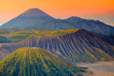 Scenic view of mountain range against sky during sunset