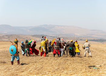 People on field against sky