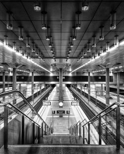 Rear view of man walking in subway