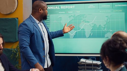 Rear view of business colleagues working in office